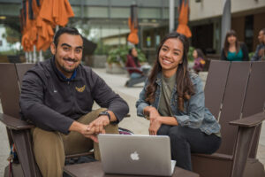 CSUDH students sitting in front of laptop